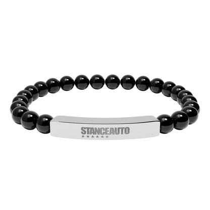 Bracelet Stance Auto Engraved Natural Stone Stretch Bar Bracelet made with black natural stone beads.