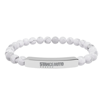Bracelet Stance Auto Engraved Natural Stone Stretch Bar Bracelet with white stone beads and polished metal.